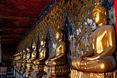 Bangkok Wat Arun - The covered passageway around the ubosot is lined with 120 Buddha statues in the sitting position.  